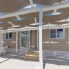 Casa mobile con pergolato e arredamento esterno.
